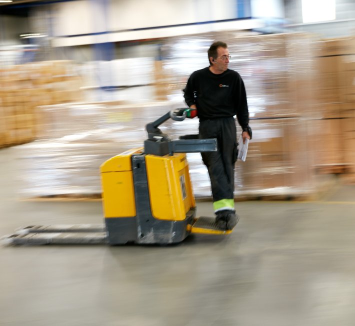 One of ColliCares storage employees controlling the goods at the storage.